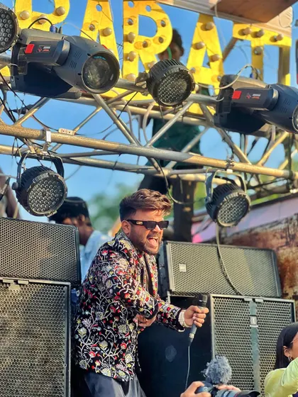 On top of the baraat truck, microphone in hand, ready to hype up the crowd. This is my element.
