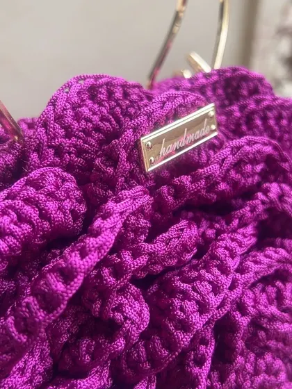 A close-up of the intricate crochet work on this deep purple Rose Bag. I love adding these little "handmade" tags to remind you of the love put into it.