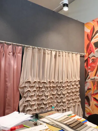 A showcase of our custom drapery options. The image features two different styles, a classic pinch pleat and a more elaborate ruffled design, demonstrating the versatility and craftsmanship of our fabric applications.
