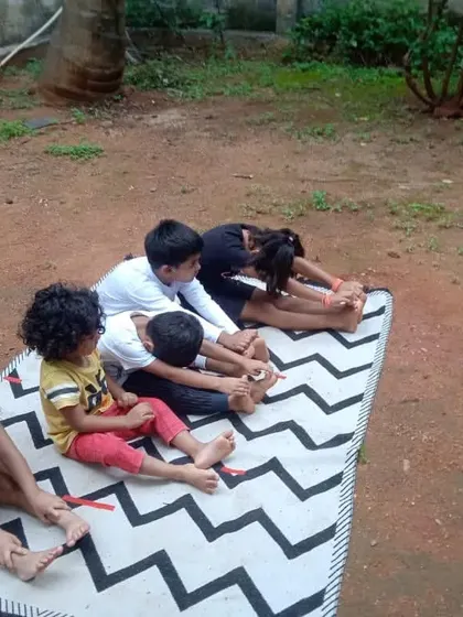 Children practicing yoga together in our outdoor space. Starting these healthy habits early helps them develop flexibility, strength, and a connection between mind and body.
