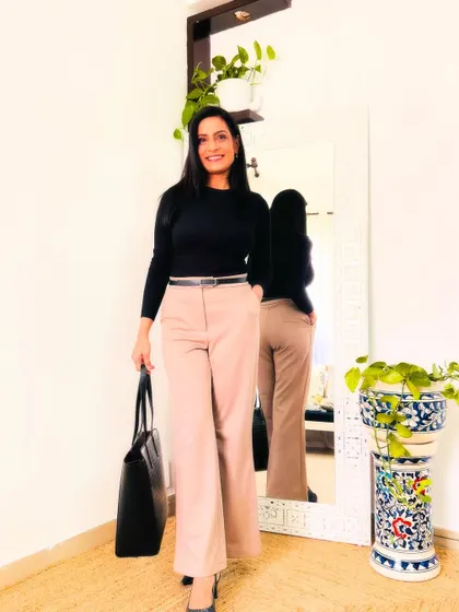 A pair of classic beige trousers. This is a must-have in every working woman's wardrobe. They are versatile and can be paired with almost any top.