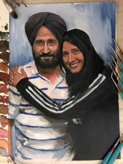 A closer look at the father-daughter oil painting. You can see the brushstrokes and the color palette I used to bring their loving embrace to life.