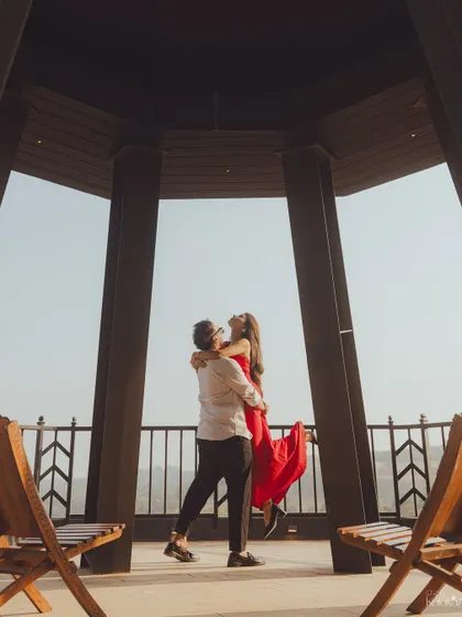 A joyful and energetic lift in a beautiful gazebo, capturing a moment of pure happiness and celebration.
