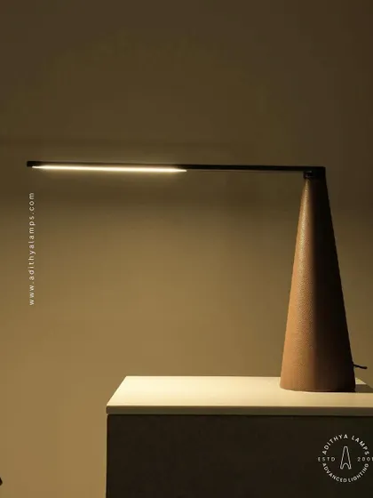 A showcase of our diverse modern table lamps. This selection includes a sleek adjustable reading lamp, a minimalist LED bar lamp, a smoked glass ambient light, and a glowing orb, demonstrating options for every style and need.