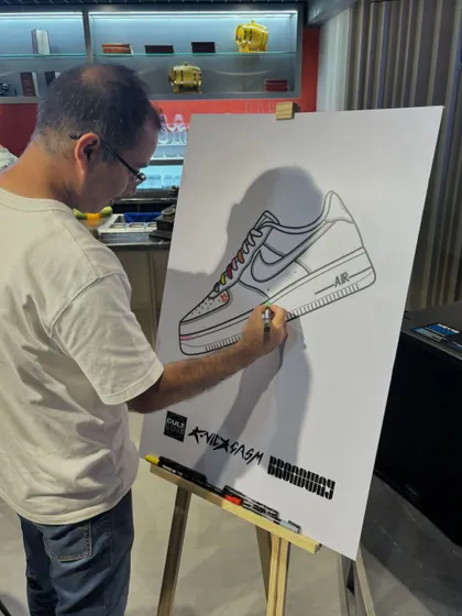 Another guest contributes to the community art piece. We provide all the markers and guidance, making it easy and fun for anyone to join in, regardless of their artistic skill.