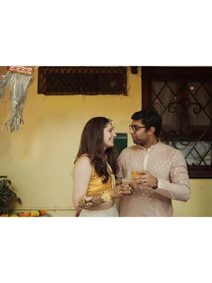 Sharing a drink and a quiet moment amidst the festivities. Even during busy events like a mehendi, I look for these small pockets of connection between the couple.