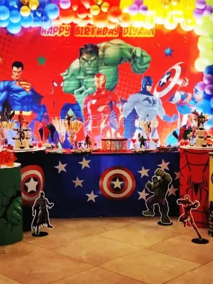 An epic Avengers and Justice League crossover party. This massive setup brings together all the favorite superheroes with a huge backdrop and multiple character standees.