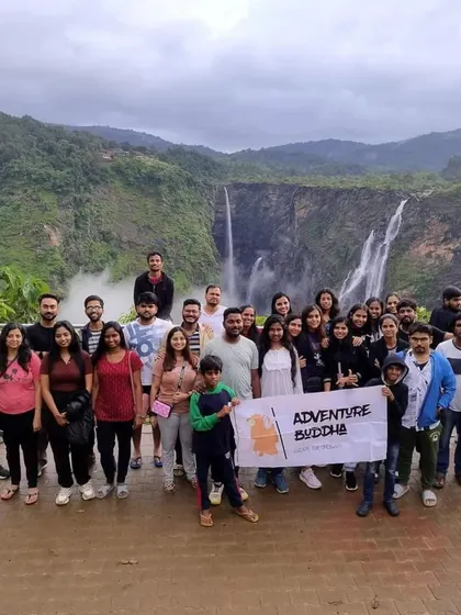 The whole tribe gathered at Jog Falls, with the Adventure Buddha banner. It's a great way to kick off a coastal adventure.