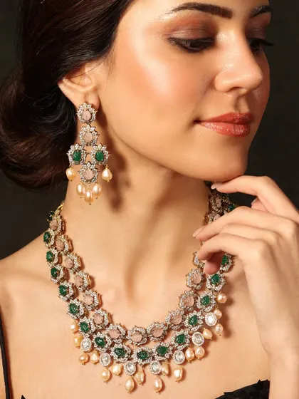 A beautiful double-layered necklace featuring floral motifs in pastel pink and green, creating a fresh and feminine look.