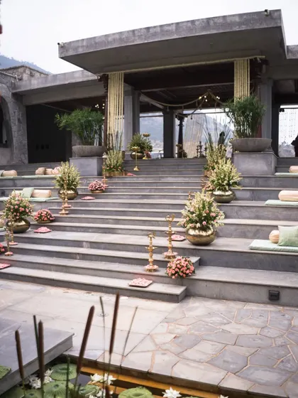 The aisle is the first step into your new life together. We lined these grand venue steps with floral arrangements and traditional brass lamps, creating a beautiful and welcoming path for the couple and their guests.