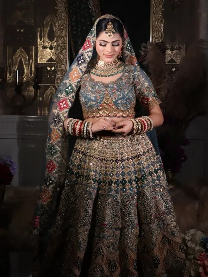 A demure bridal pose that highlights the soft, blended eyeshadow and the overall radiance of the skin.