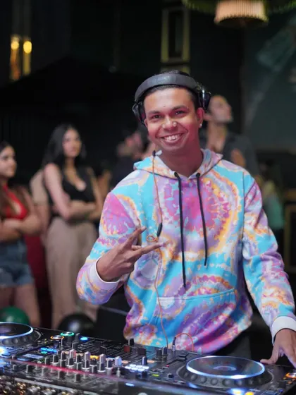 Rocking a tie-dye hoodie and sharing good vibes. This is me posing for a quick photo while keeping the party going.