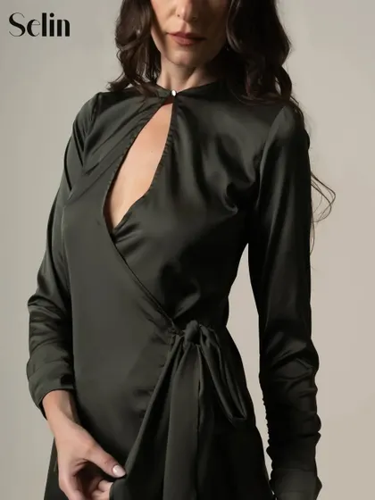 A close-up from my publication in Selin Magazine. This shot highlights the elegant design and satin texture of the green dress.