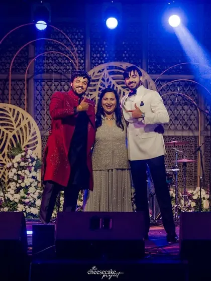 The performers posing on stage after a successful Sangeet dance.