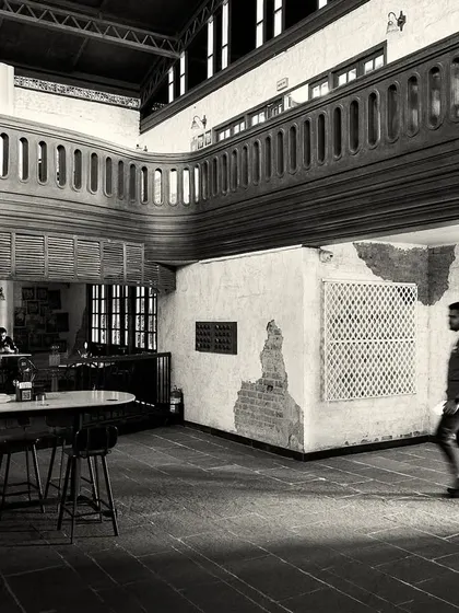 A person walking through the space, giving a sense of its scale and the open, flowing layout.
