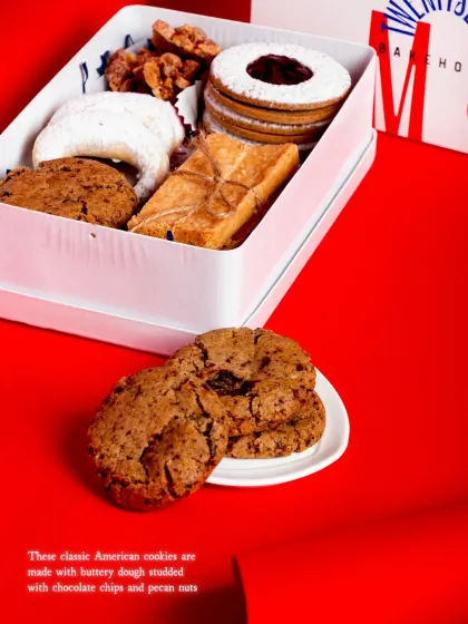 The Christmas Cookie Tin features classic American chocolate chip pecan cookies.
