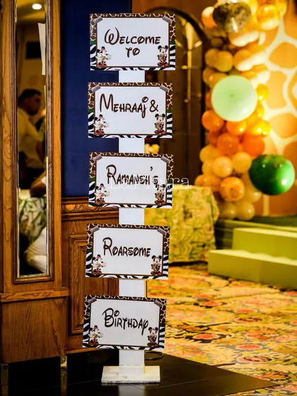 A personalized welcome signpost for the 'Roarsome' birthday party of Mehraj and Ramansh, guiding guests with a touch of safari flair.