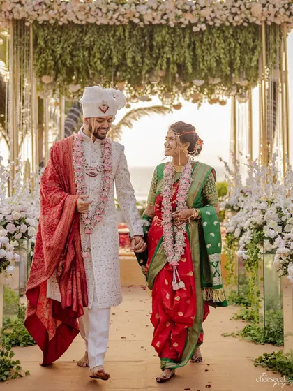 A classic walk down the aisle as a married couple, looking happy and in love.