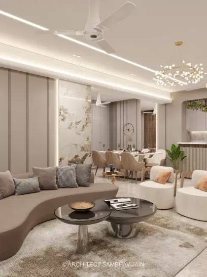 This living space exudes modern luxury with its harmonious blend of organic curves, rich textures, and sculptural furniture. The open kitchen concept seamlessly integrates with the living and dining areas, fostering a sense of connectivity and spaciousness.