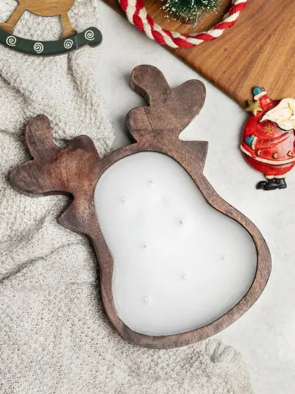 This wooden reindeer candle holder is the perfect companion to the Christmas tree version. It's a substantial, multi-wick candle that makes a wonderful centerpiece for your holiday table.