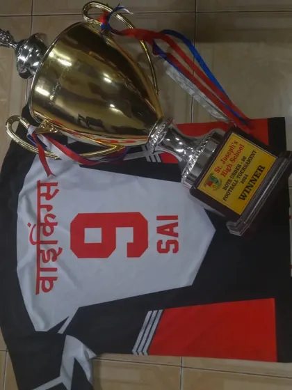 The winning combination: a Vikings jersey and a championship trophy. A common sight at our academy.
