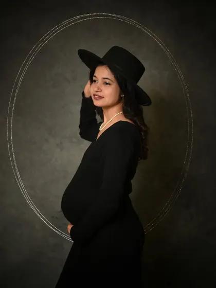 Accessorizing with a stylish hat can completely change the vibe of a portrait, adding a touch of mystery and fashion-forward flair.