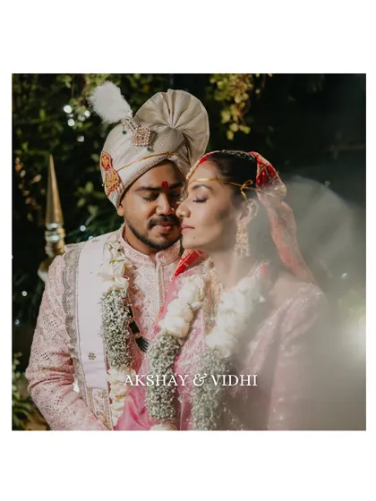 A soft and dreamy portrait of the couple after their wedding ceremony. The light flare adds a magical touch, emphasizing the romance and intimacy of the moment.