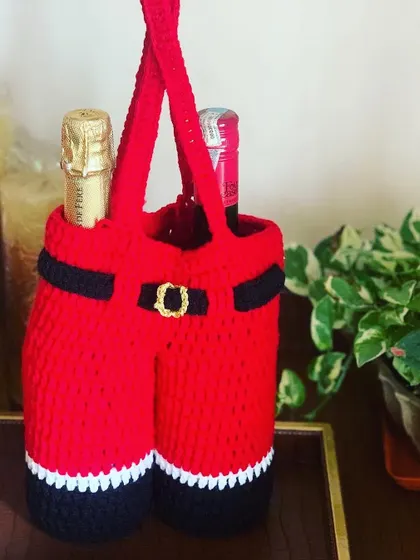 This unique wine carrier is designed to look like Santa's pants and can hold two bottles. It's a fantastic and memorable gift for any host.