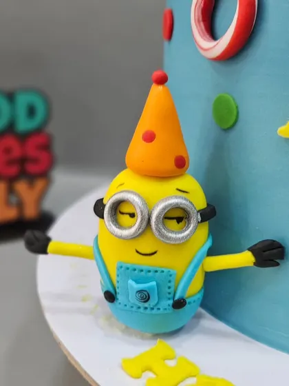 Another adorable Minion figurine, this one wearing a party hat and ready to celebrate.