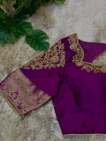 Another angle of the purple blouse, highlighting the elegant neckline and the perfect stitching.