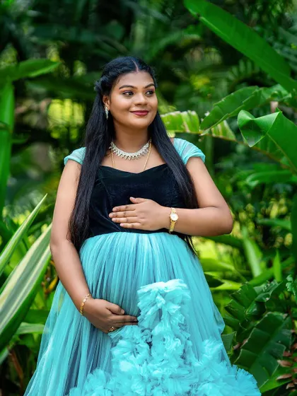 Another angle of this beautiful maternity portrait, focusing on the mother-to-be's serene expression. We take multiple shots to capture the perfect look and feel.