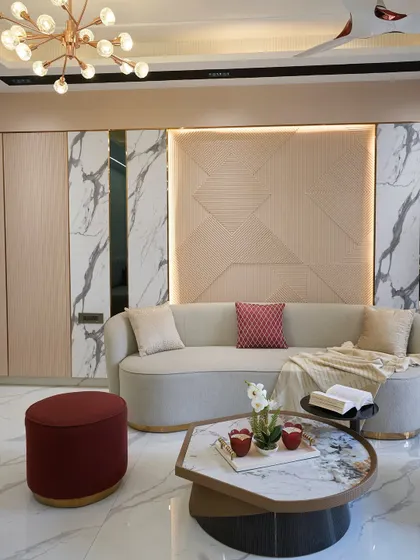 The geometric texture on the wall, combined with marble-finish panels, creates a sophisticated backdrop. This is a clever hack to make a wall look luxurious without a huge expense.