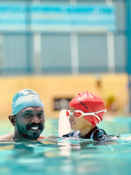 A happy moment from our infant batch. Our coaches are experts at making our littlest swimmers feel secure and joyful as they explore the water, often with the help of flotation aids.