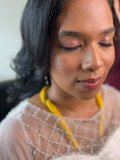 A close-up of Aruna's soft, shimmery pink eye makeup. It's a simple yet elegant choice for a minimalist bride.