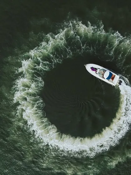 This aerial drone shot captures a luxury yacht carving a perfect circle in the water. It’s a unique and cinematic perspective that I bring to destination pre-wedding shoots, adding a touch of adventure and grandeur.