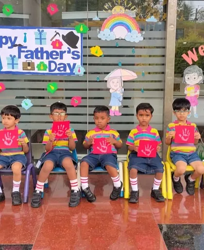 Students display their handprint cards, a personal and heartfelt gift for their fathers on this special day.