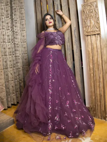 A dramatic pose highlighting the flow and detail of a magnificent purple lehenga. My goal in these shoots is to make the outfit look as stunning in the photo as it does in person.