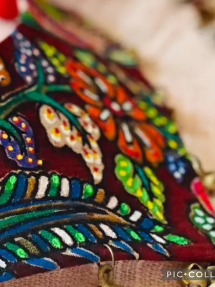 A collage showing different sections of a richly detailed, hand-painted fabric necklace, highlighting the intricate patterns and vibrant colors.