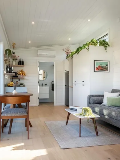 An overview of a compact living space I designed, showing how a small area can accommodate a living room, dining nook, and kitchen without feeling cluttered.