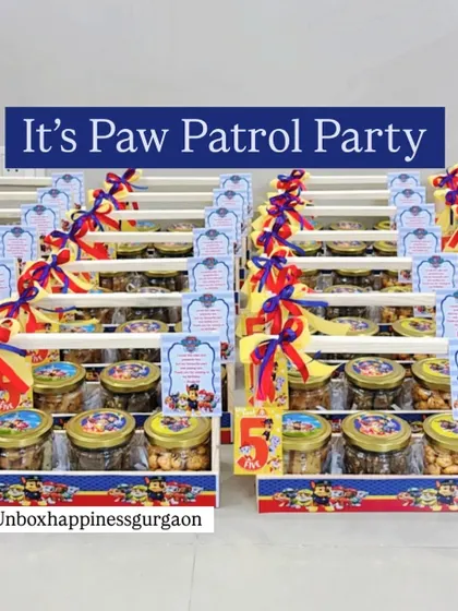 "It's a Paw Patrol Party!" This image shows a large order of 'Paw Patrol' themed return gifts, all lined up and ready for the celebration.