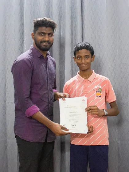 A student is recognized for his achievement in the ABRSM graded exams. My goal is to provide a comprehensive music education.