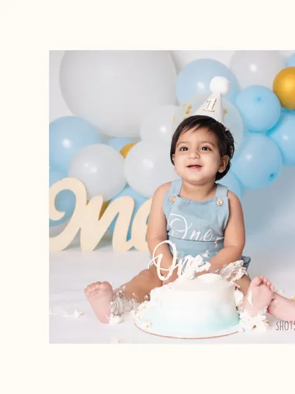 The smile of a one-year-old who knows he's about to get his hands on some cake! I make sure to capture these moments of sweet anticipation right before the smashing fun begins.