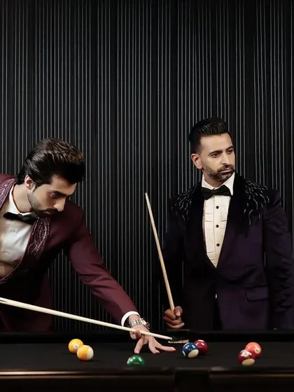Style and confidence go hand in hand. Our clients are pictured here in our statement velvet tuxedos, showcasing how bespoke tailoring can reflect individual personality while maintaining a sophisticated aesthetic.