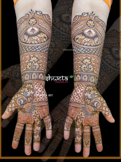 A beautiful blend of floral, peacock, and elephant motifs. This full-hand design is a great example of how I combine different traditional elements into one cohesive piece.