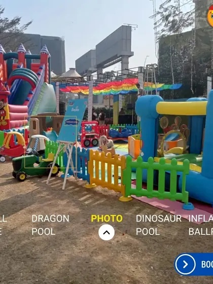 A massive outdoor setup for a large event, featuring multiple large-scale bouncy castles and slides. This shows how I can cater to bigger parties, providing enough activities to keep a whole crowd of kids entertained for hours.