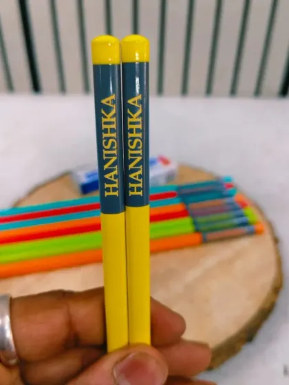 A closer look at the personalized pencils, showing the clear and crisp name printing.