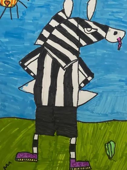A zebra dressed as a referee. This humorous and creative drawing is a great example of how we encourage students to think outside the box and combine different ideas.