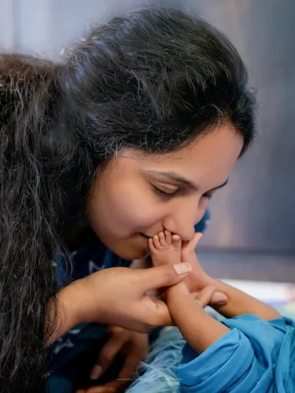 A mother's kiss on tiny toes. I focus on these small, tender interactions that speak volumes about the infinite love you have for your child.