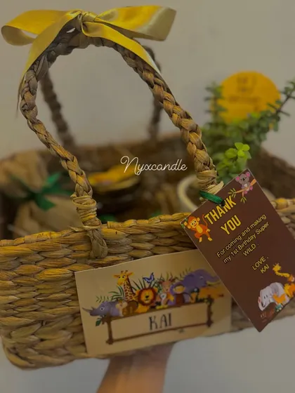 A still shot of our premium jungle-themed birthday basket. The natural texture of the basket combined with the custom animal-themed tags creates a wonderfully rustic and charming gift.