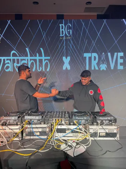A handshake with a fellow artist on stage. Collaboration and mutual respect are huge parts of the music scene for me.